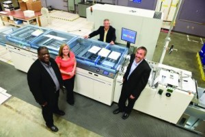 In-line finishing on the inkjet presses—comprising a buffer, cutter, separator and stacker—has greatly enhanced productivity and efficiency. From left: Eric Seldon, Gillian Seguin, Frank Butler and Mike Thomas.