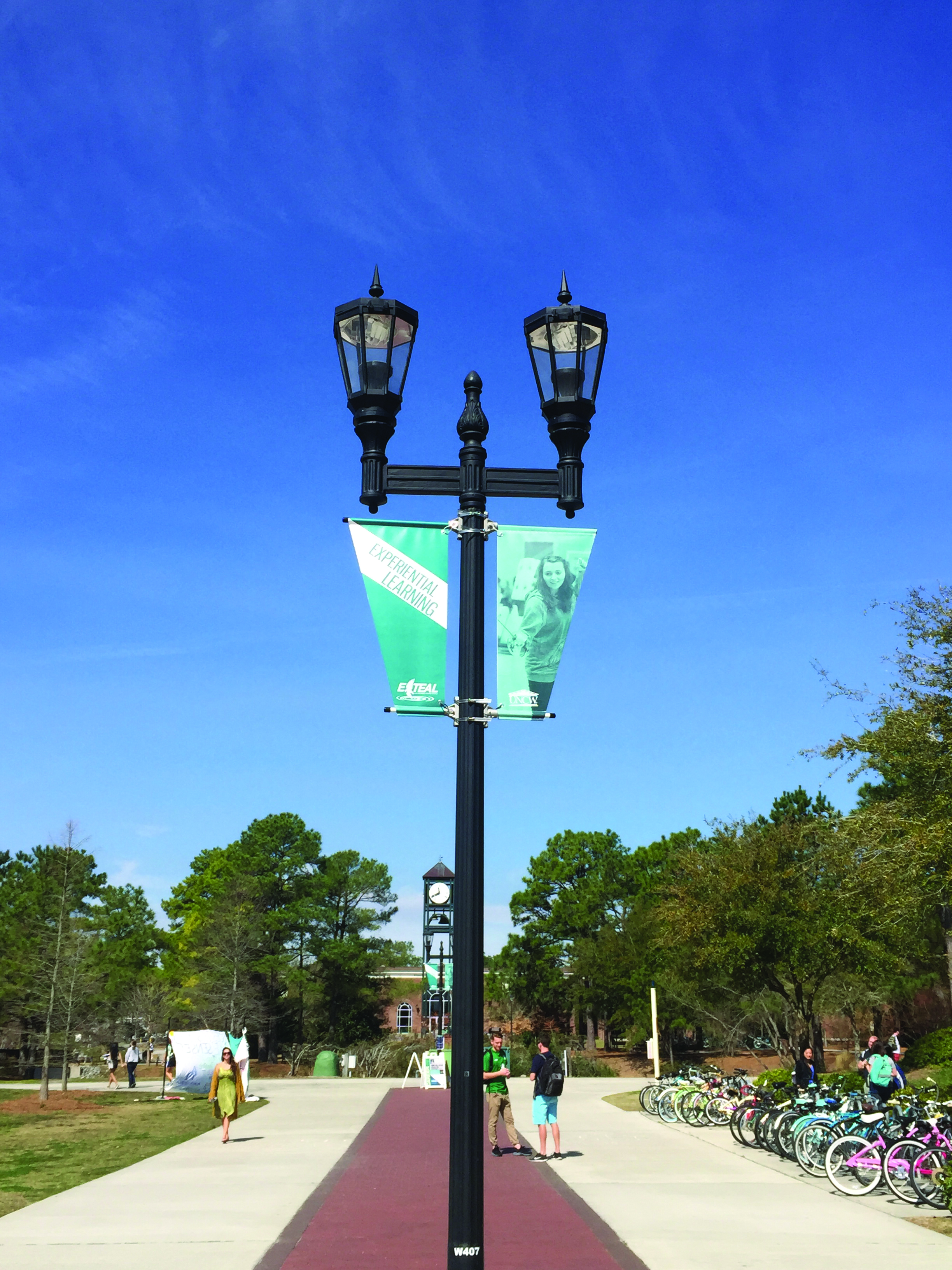 The in-plant printed banners and hung them from light poles along Chancellors Walk.
