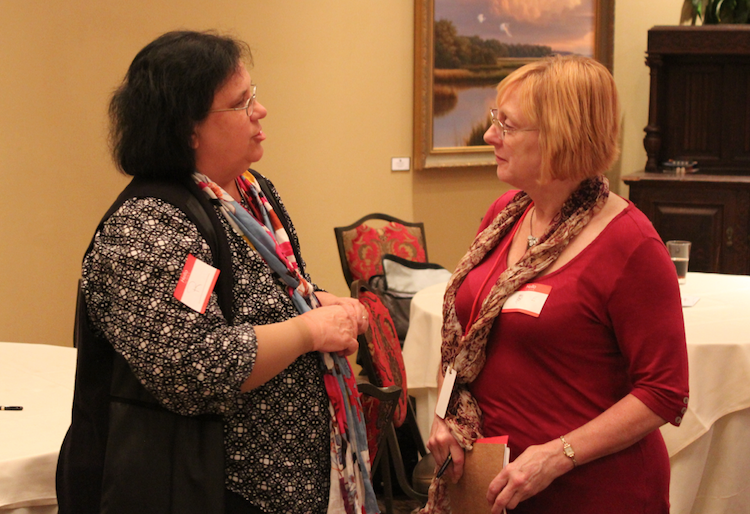 Penny Bellard, or the University of Arkansas, talks with Sally Roberts, from the University of West Georgia.