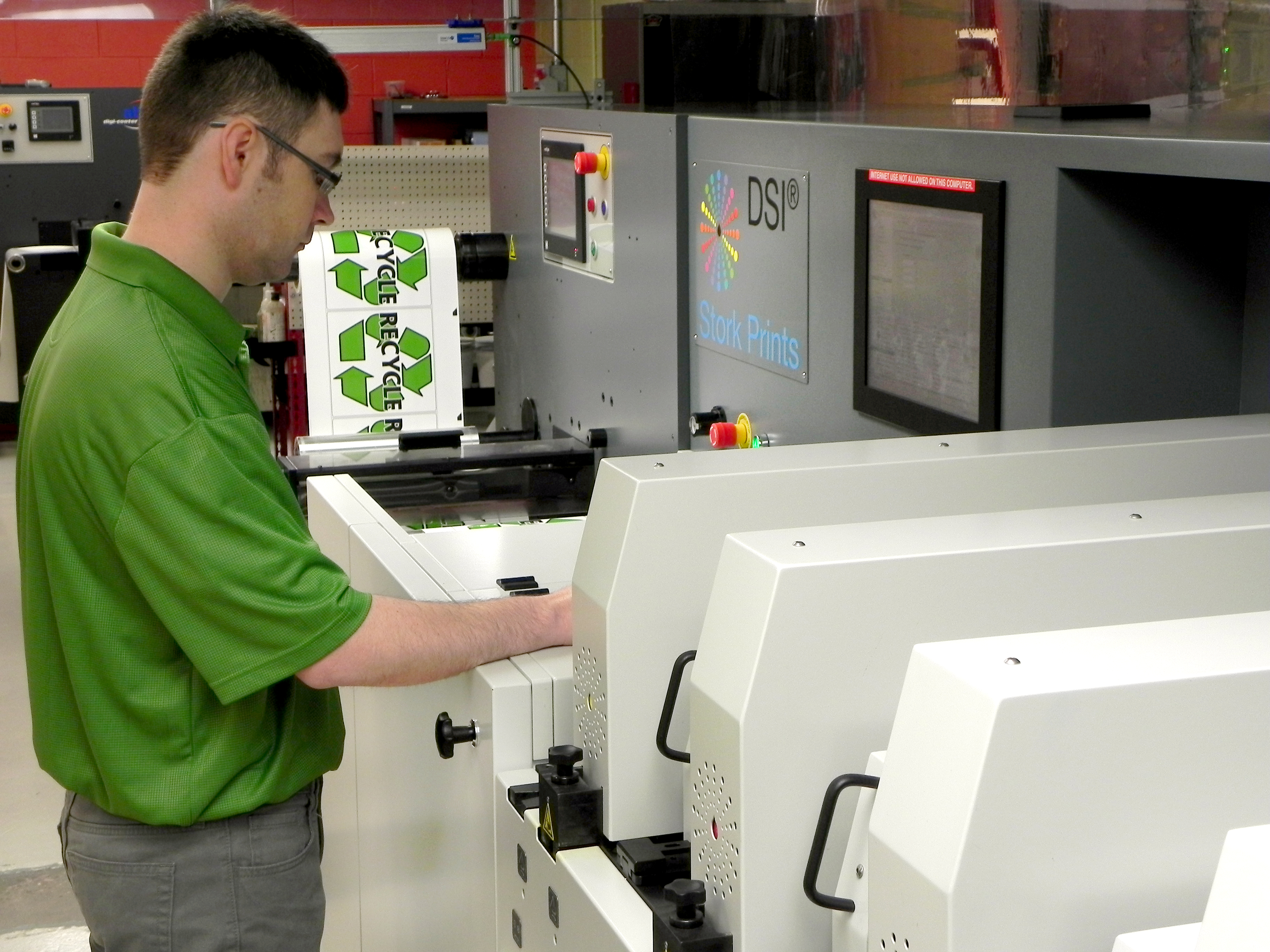 Tom Wateski, a digital press operator at McLoone, runs the SPGPrints DSI press.