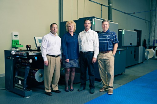 From left, Director of Sales and Marketing Barry Wendell, Geri Wise, Randy Wise and COO Alan Etheridge in front of Hyde Park Label’s HP Indigo WS 6600