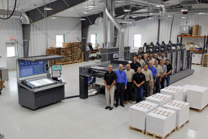 The staff at Haines Printing stand next to the company's new RMGT 9 Series press.